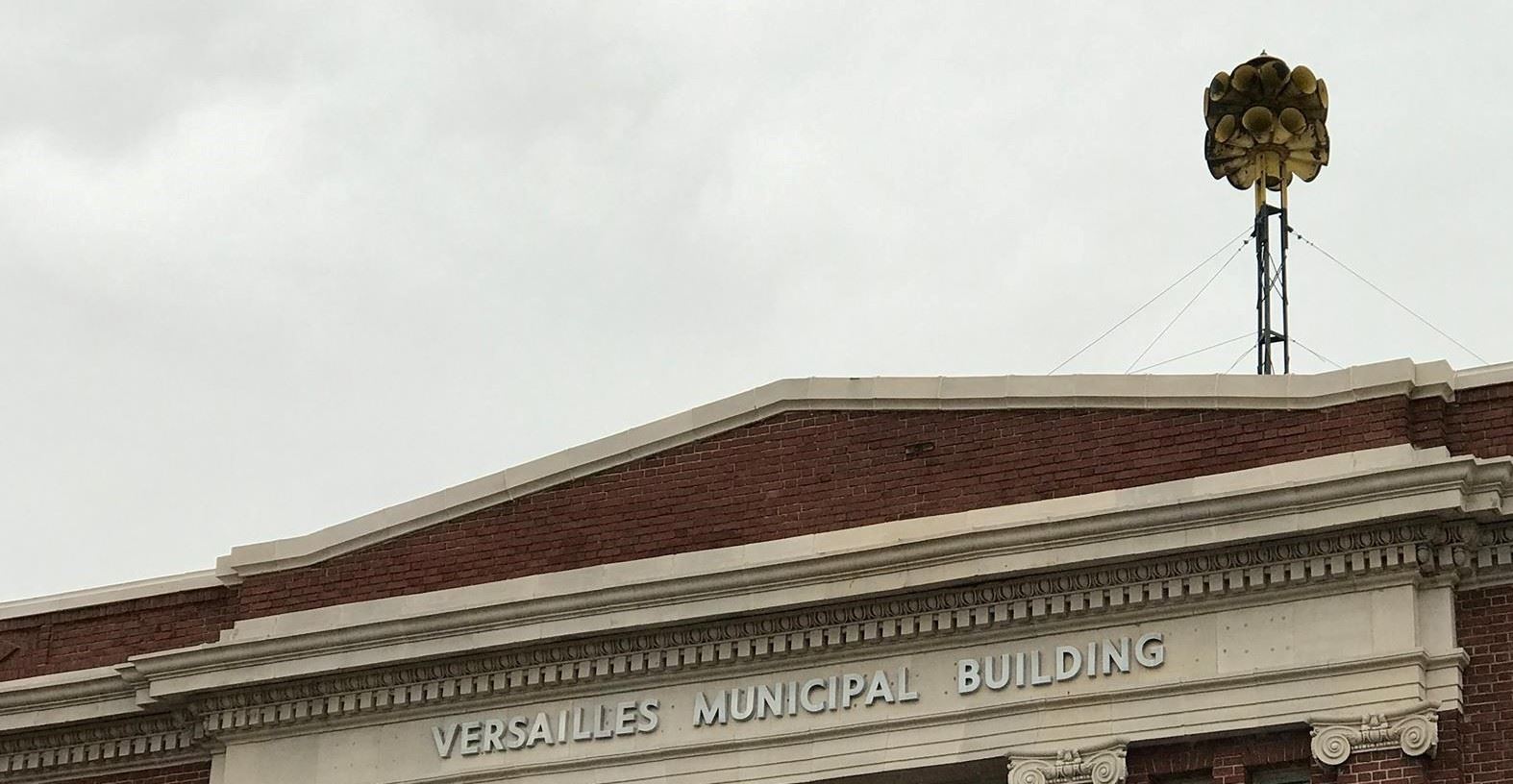 A multi-directional audio siren on top of the Versailles Municipal Building roof